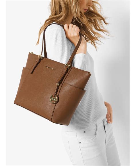 michael kors jet set east west top zip tote|michael kors saffiano tote.